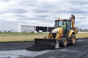 Lehigh Valley Division: A Caterpillar backhoe cleans millings off the Taxiway at ABE International Airport.